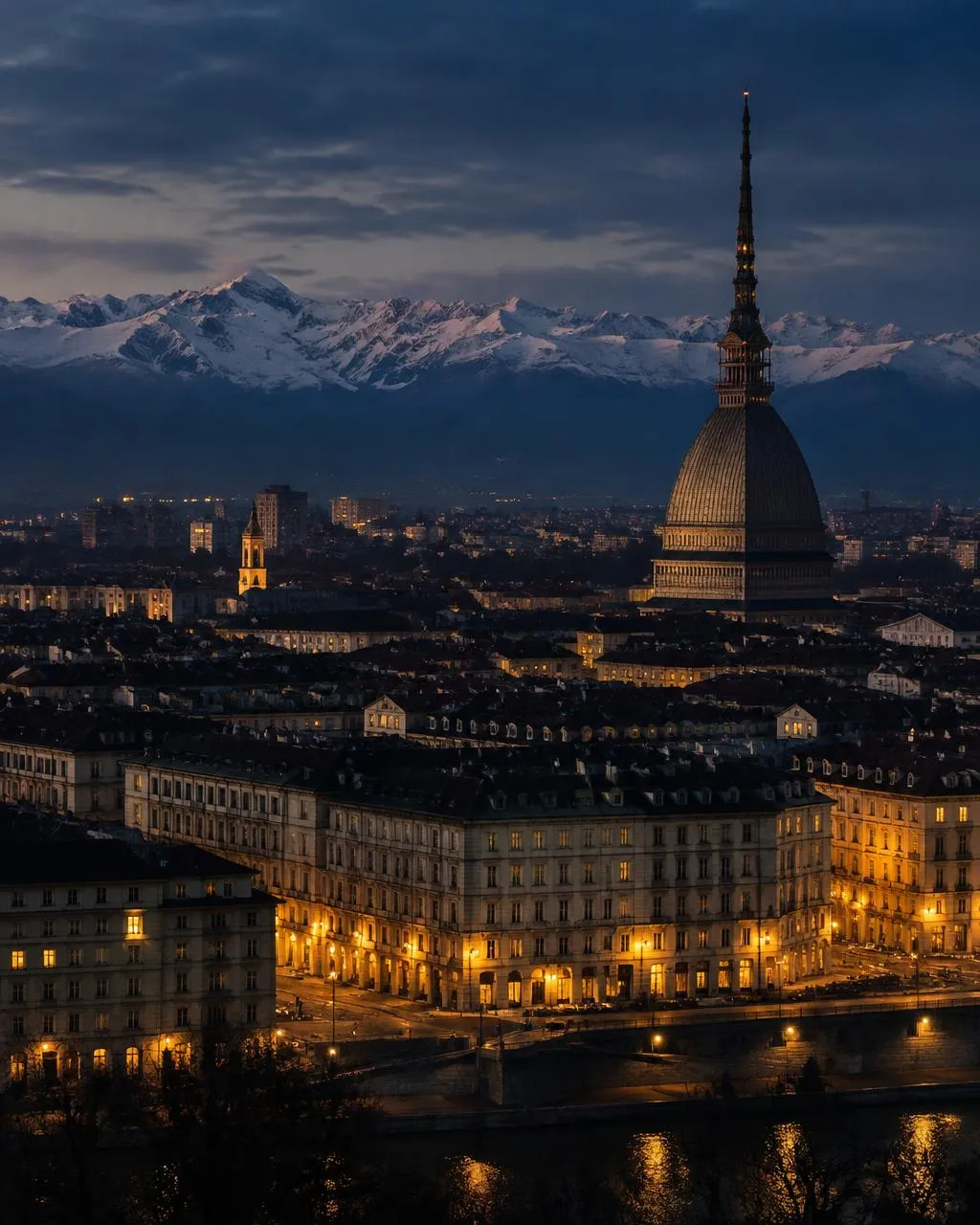 Turin at blue hour with the Mole Antonelliana and the Alps